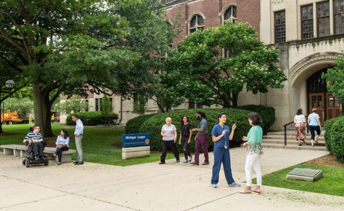 Students and colleagues chatting outside of Michigan League