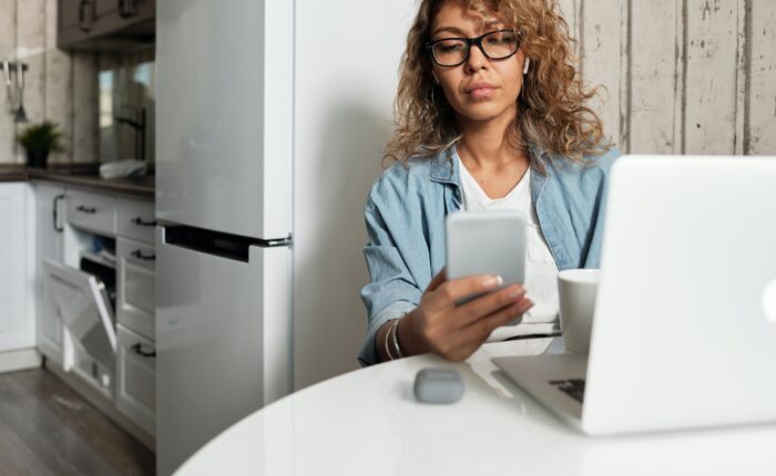 woman reading news on phone