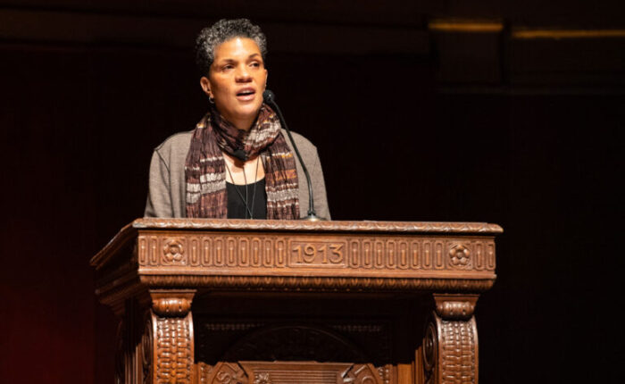 a woman standing behind a podium